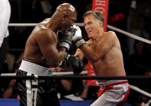 Former Massachusetts Governor and two-time presidential candidate Mitt Romney fights five-time heavyweight champion Evander Holyfield during their boxing match in Salt Lake City, Utah