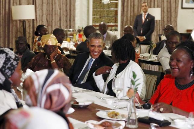 U.S. President Barack Obama attends a private dinner with family members at his hotel restaurant after arriving in Nairobi