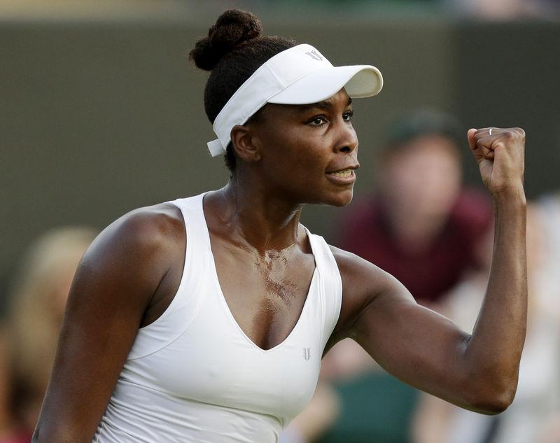 Venus Williams of the U.S.A. celebrates after winning her match against Yulia Putintseva of Kazakhstan at the Wimbledon Tennis Championships in London