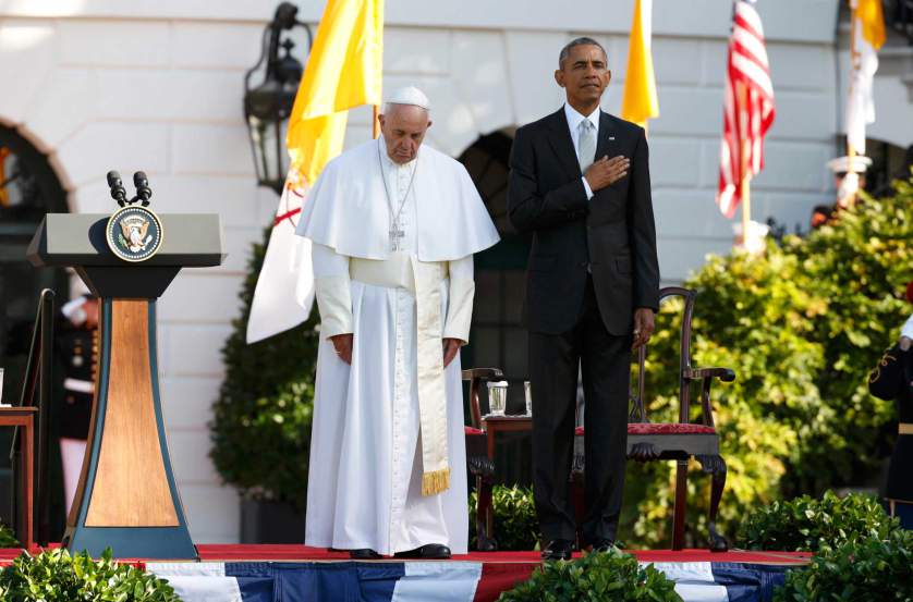 Pope Francis and U.S. President Obama stand onstage during the playing of the U.S. National Anthem at an official welcoming ceremony on the South Lawn at the White House in Washington
